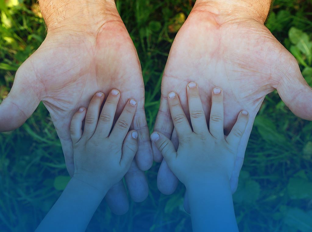 kid's hands on parent's